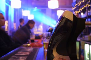 Looking past the guiness pump ata bar